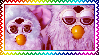 A stamp with two Furbies.